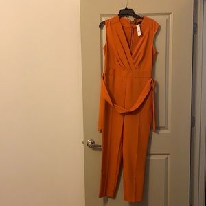 Warm orange long romper.